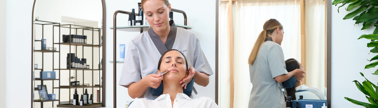Woman having a facial from a trained therapist.