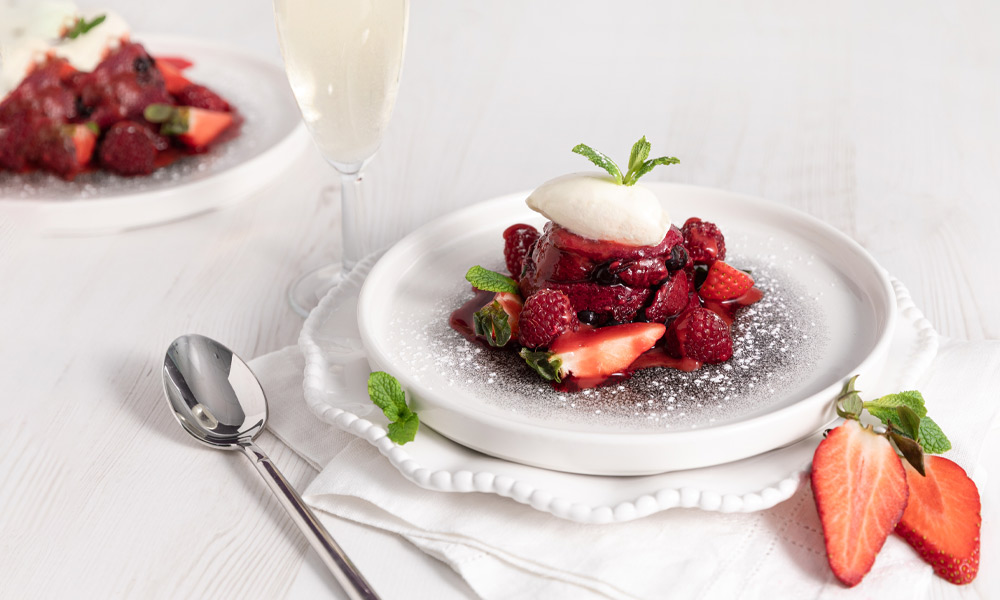 Refreshing fruit summer pudding served with strawberries