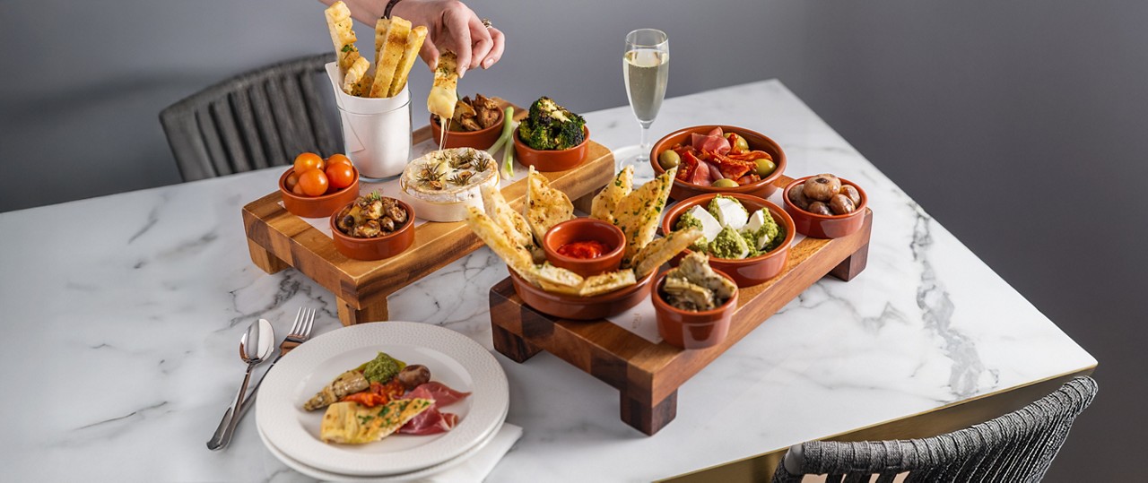 Sharing Platter including flatbread, dips and a selection of antipasti.