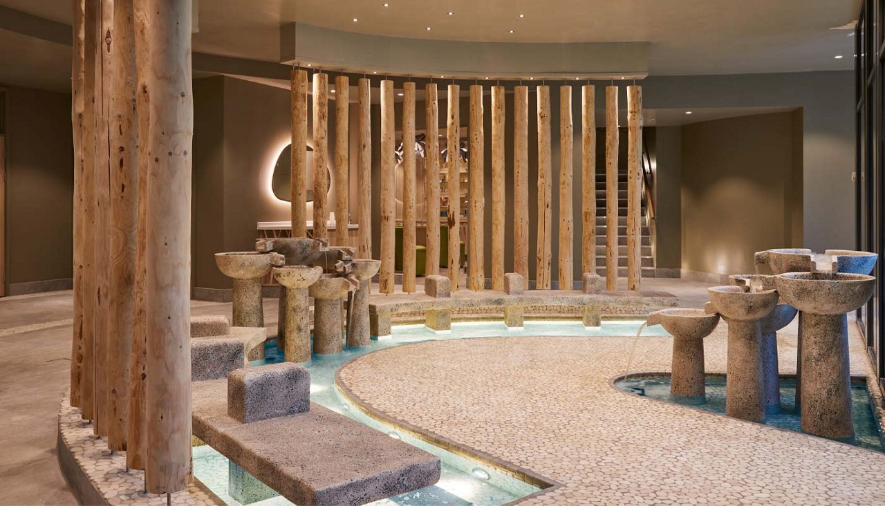 Stone footbaths with water fountain features.