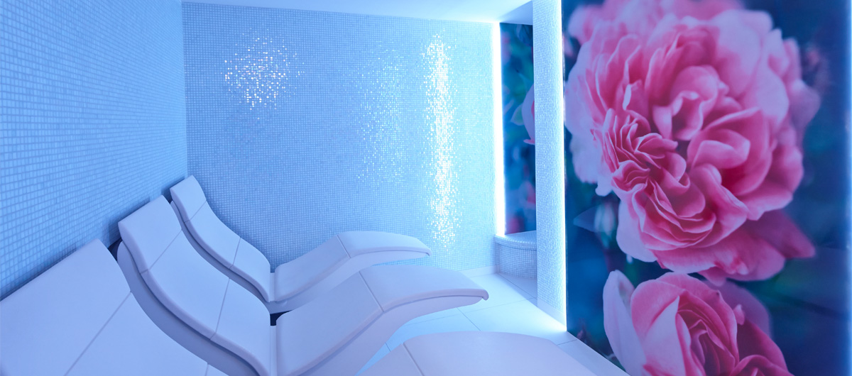 experience room with curved seats with blossom image on wall