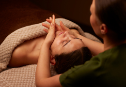 Woman having a facial massage from a trained therapist.