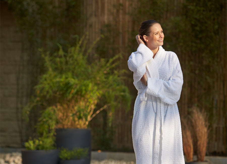 Woman outdoors in a Aqua Sana robe.