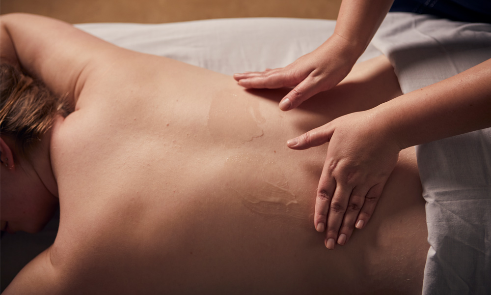 women having a back massage