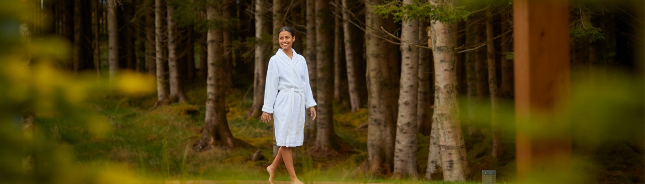 women walking through the forest