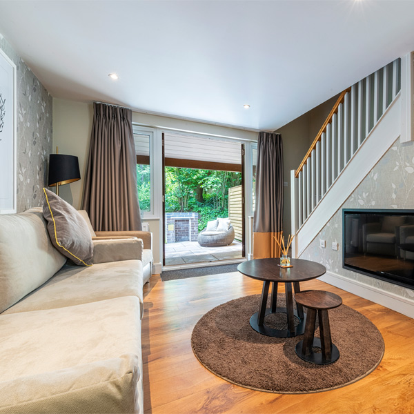 Inside a Spa Apartment with views out to the surrounding forest.