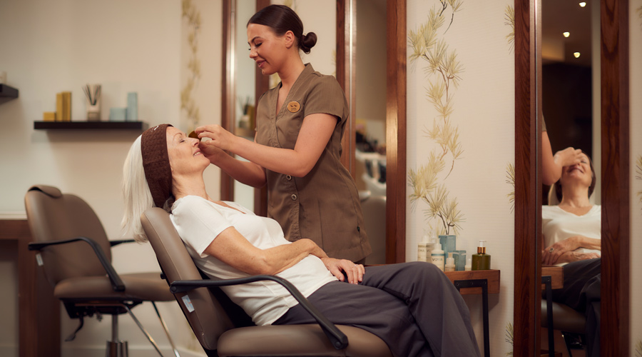 therapist performing eye treatment 