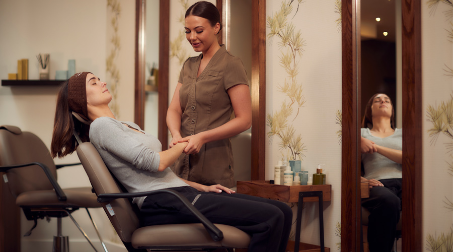 therapist giving hand massage