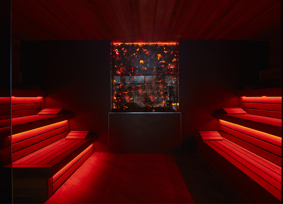 lava sauna with red lighting and tiered benches
