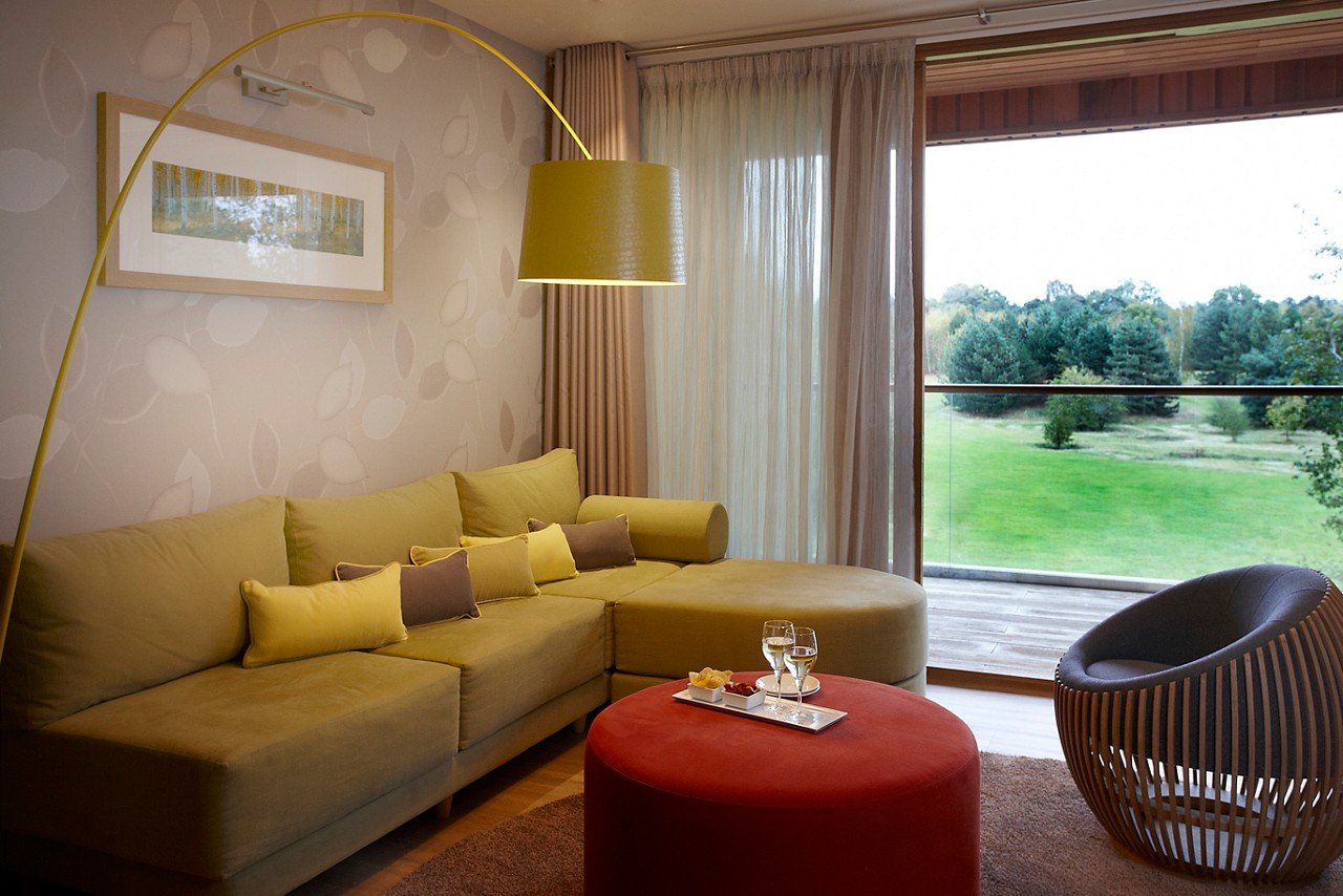 Living space with comfortable seating in the Luxury Spa Suite.
