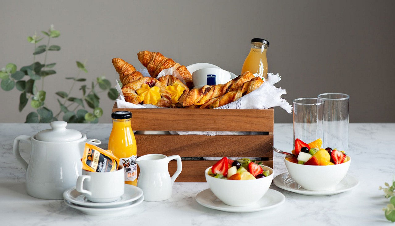 Selection of pastries and beverage options.