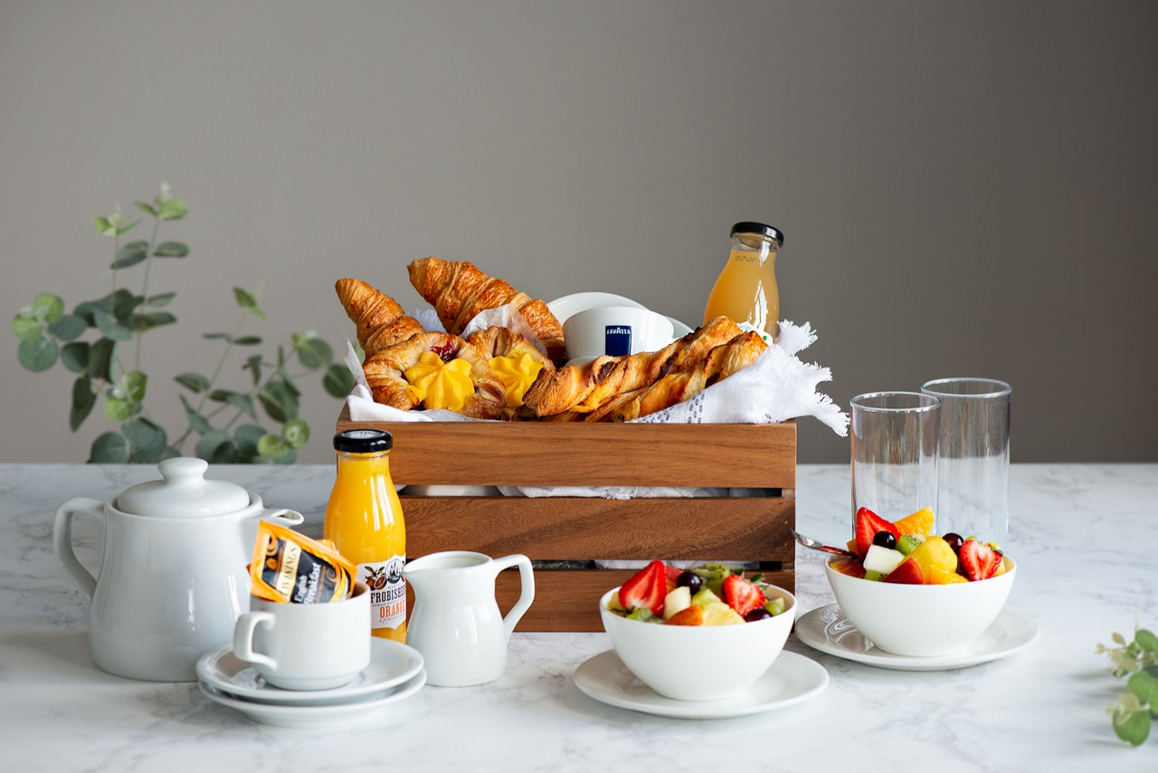 Vitalé Spa Suite breakfast, including pastries, fresh fruit and a selection of beverages.