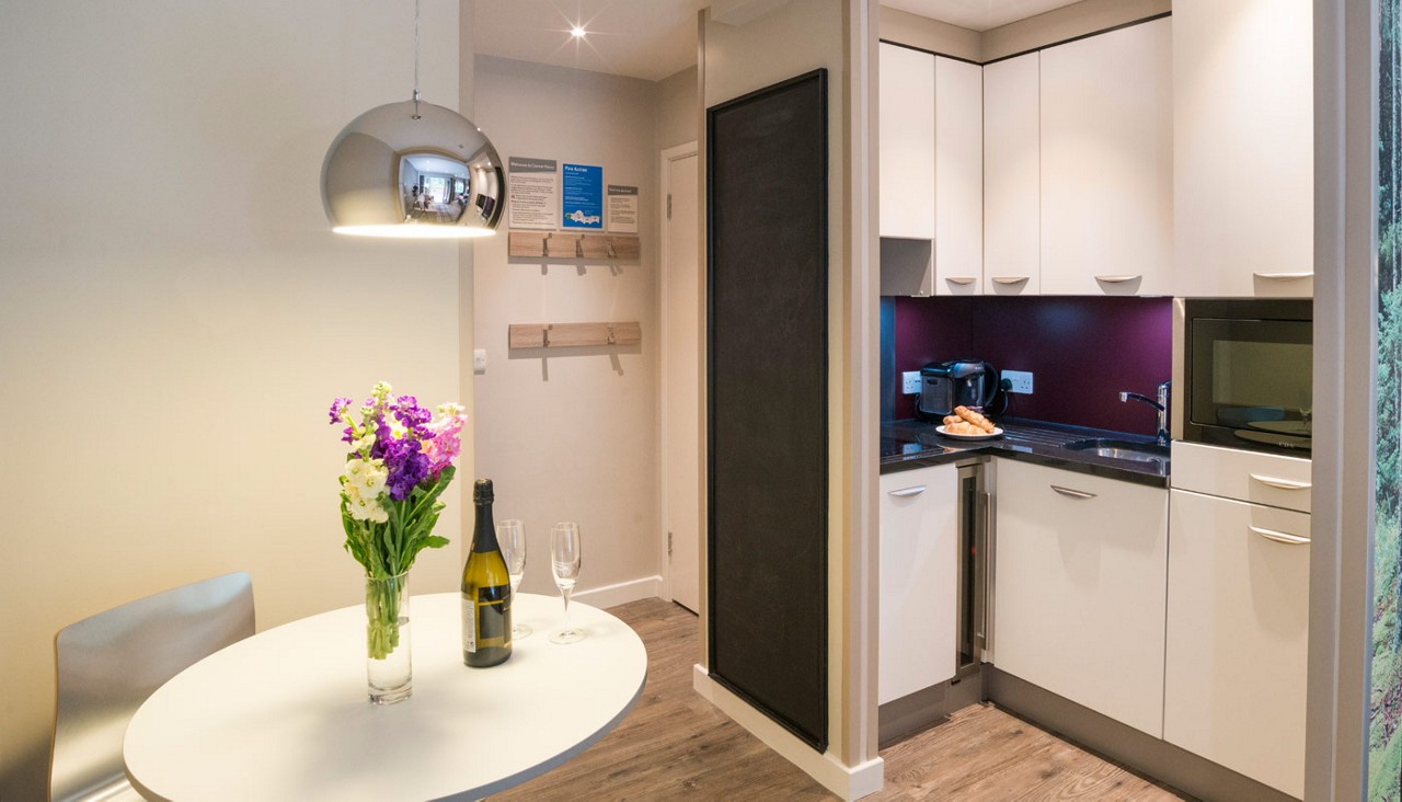 Living space with a small kitchen.