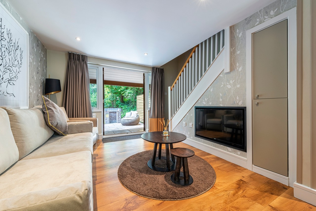 Living space and outdoor terrace in the Spa Break apartment.