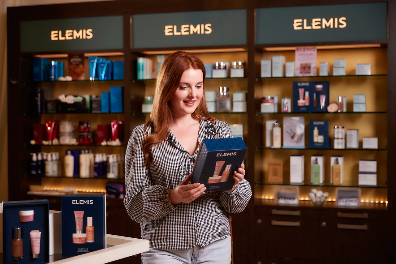 Man looking at products inside the Forest Spa Boutique.