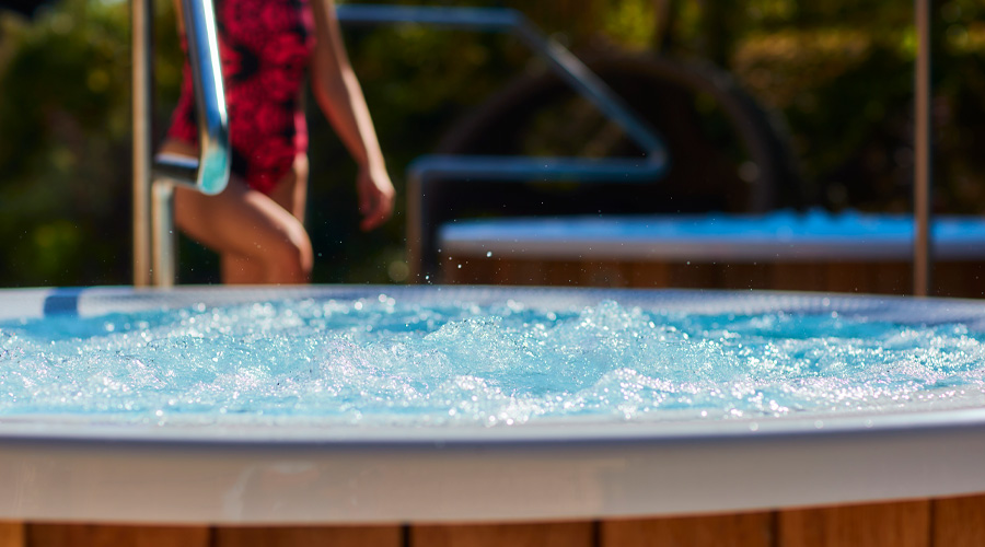 Couple soaking in an outdoor pool.