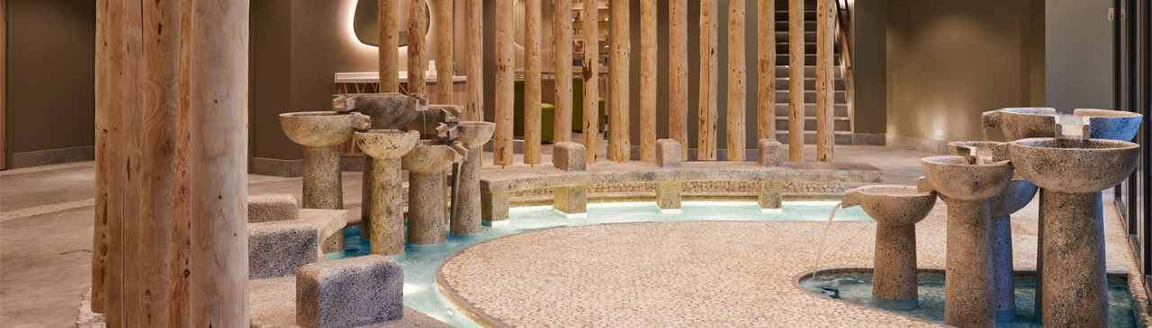Stone footbaths with water fountain features.