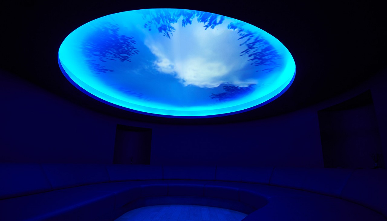 Oval room with comfortable chairs and a glass dome on the ceiling.