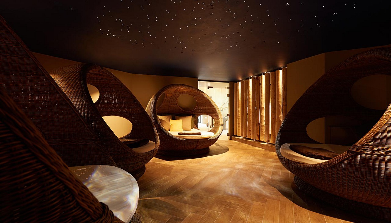 Cocoon seats in a dim lit room.