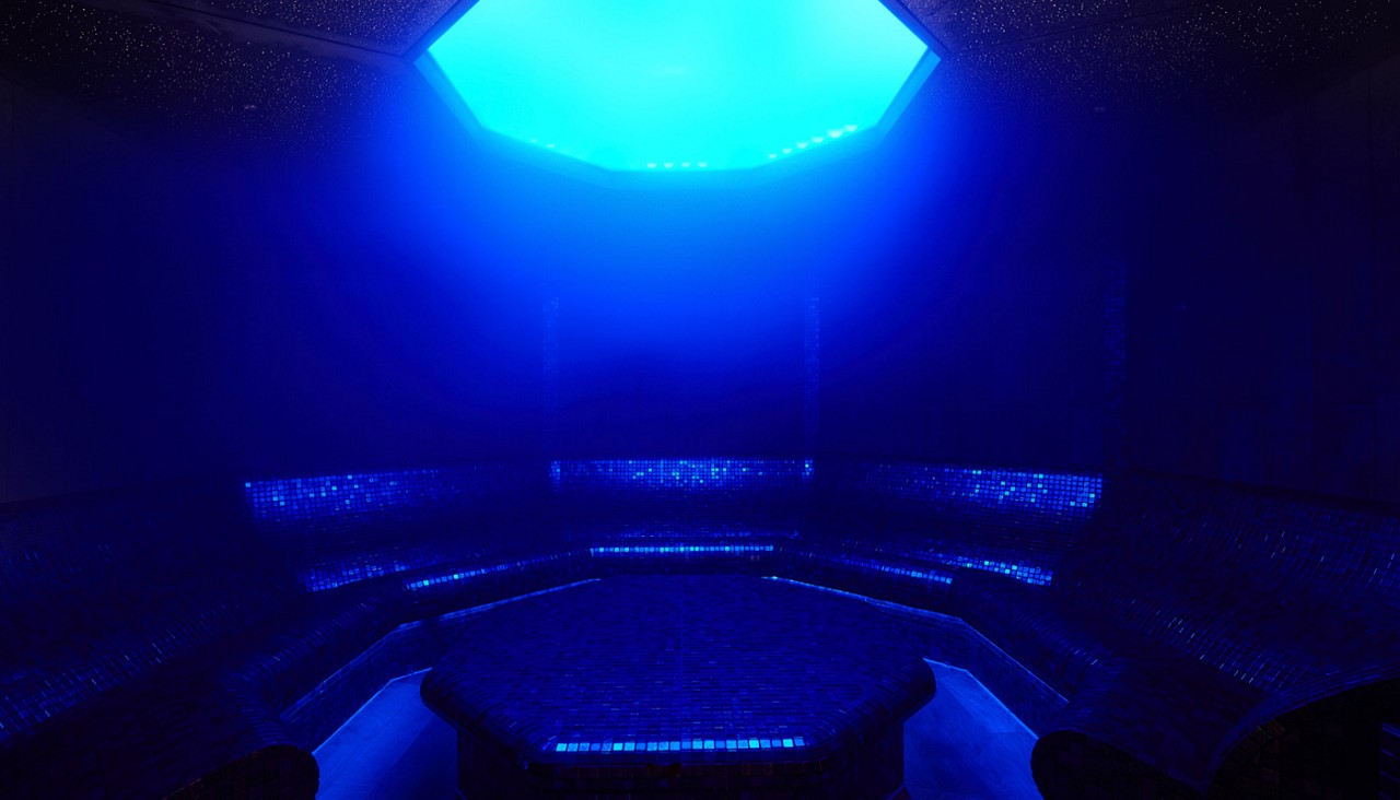 Curved room with decorative tiles.