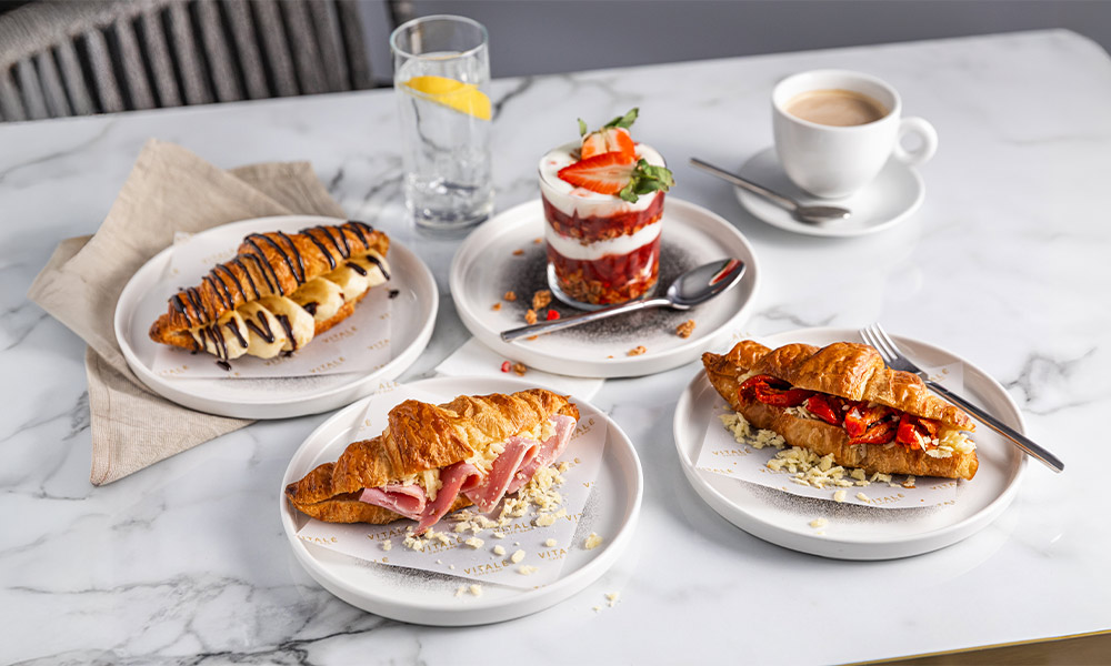 Breakfast options including granola and croissants. 