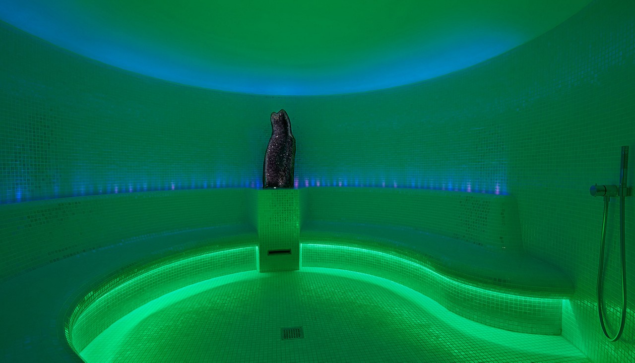 Glowing curved Alpine Steam room.