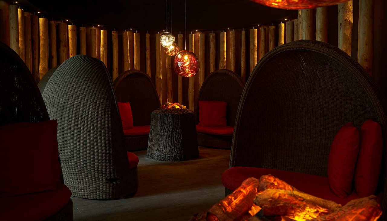 Large cosy seating in a dim lit room.