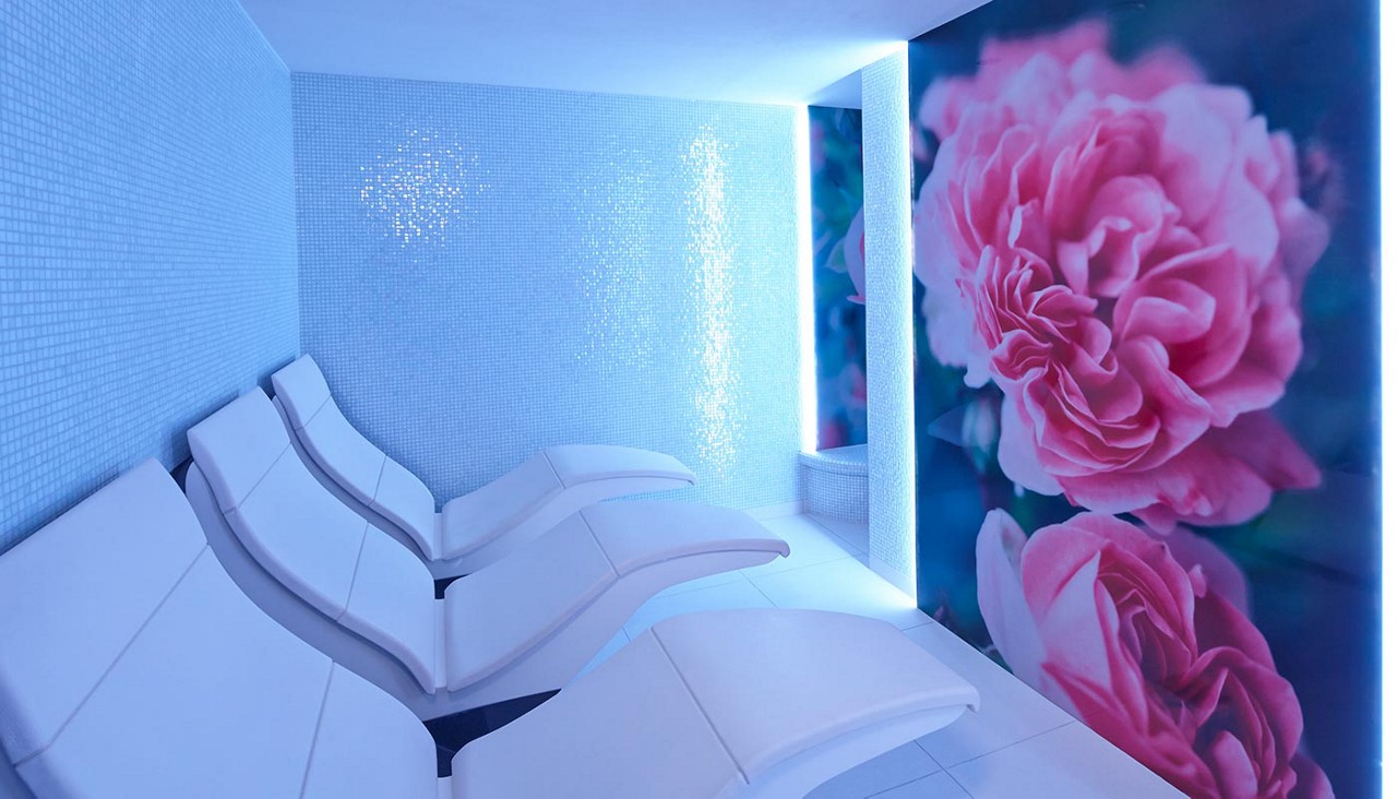 Floral room with comfortable seating.