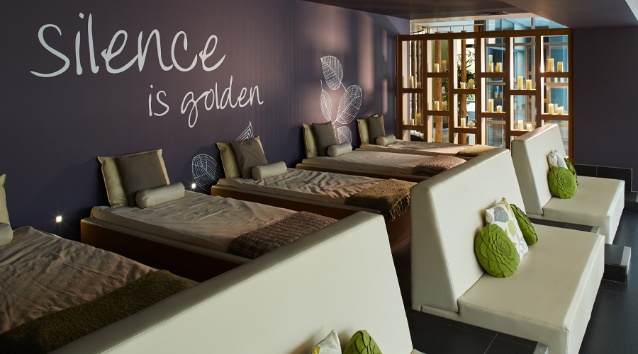 Waterbeds lined up against a wall that reads 'silence is golden'