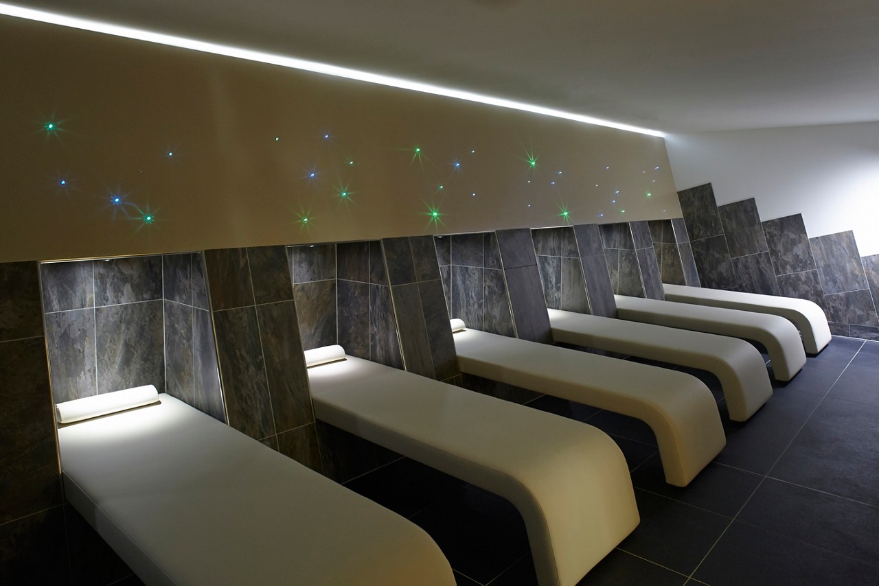 Salt Inhalation beds in a tiled room with soft lighting.