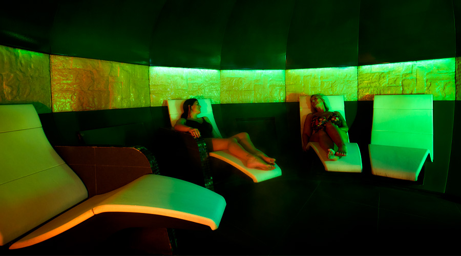 experience room with curved seats and purple lighting