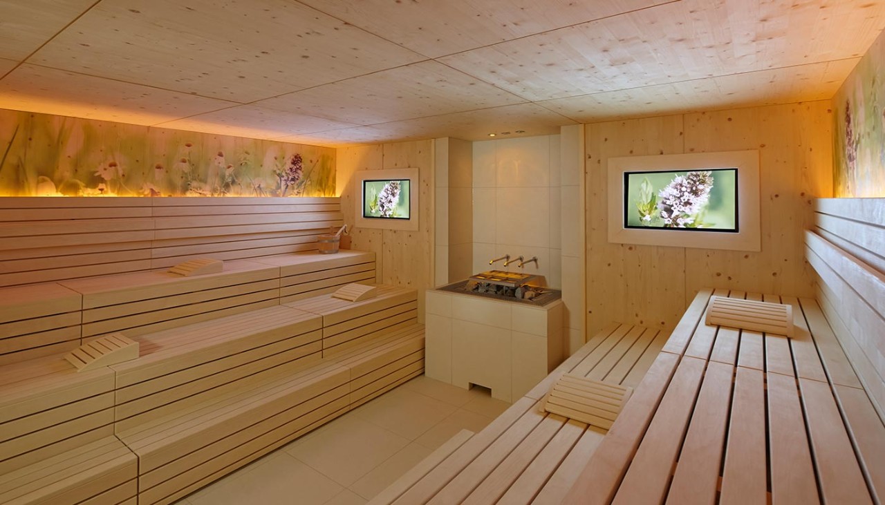 Herbal sauna with soft lighting and nature inspired imagery.