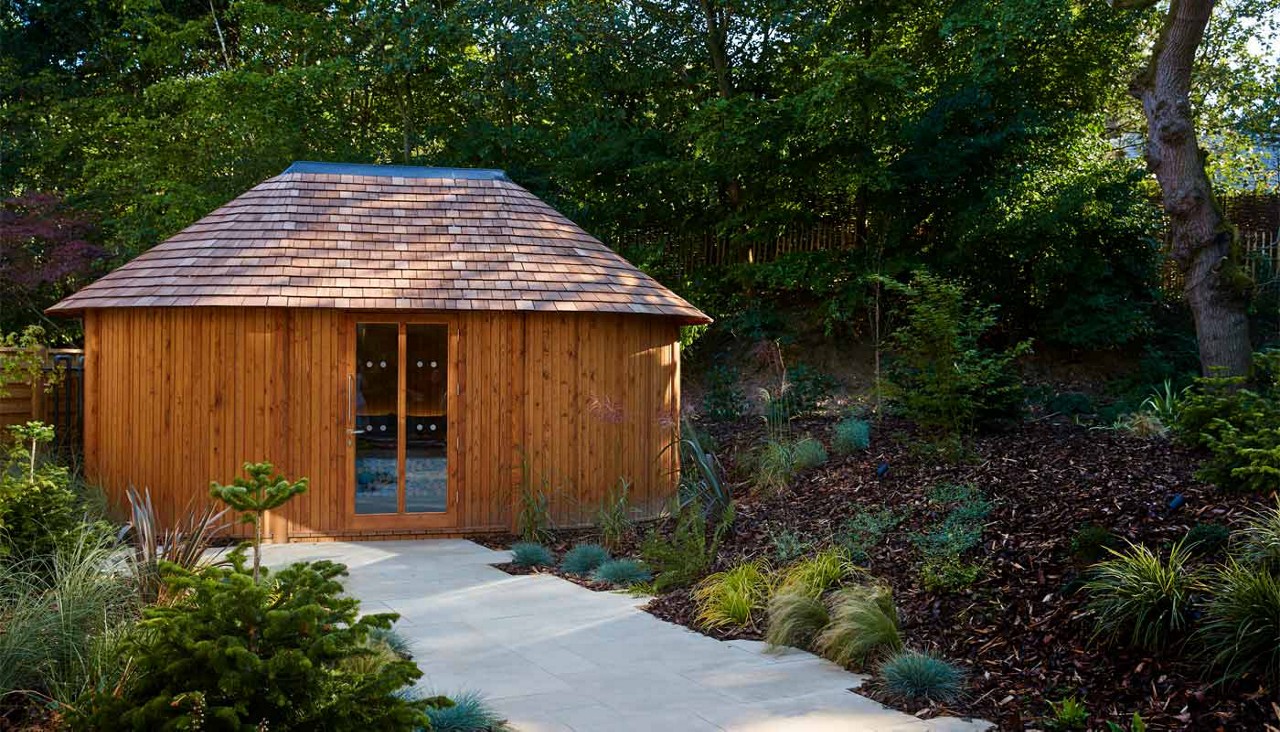 Outdoor Snug room surrounded by forest gardens.