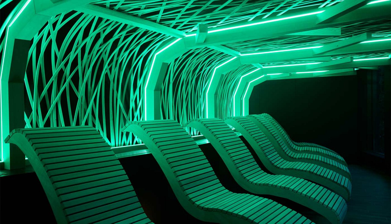 Decorative ceiling design over contoured lounging chairs.