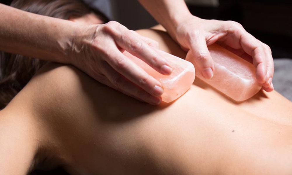 back massage using salt stones