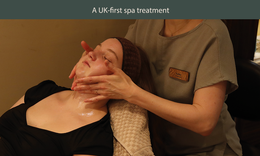 Teen girl having a facial by a spa therapist.
