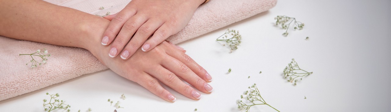 Two hands showing beautifully painted nails.
