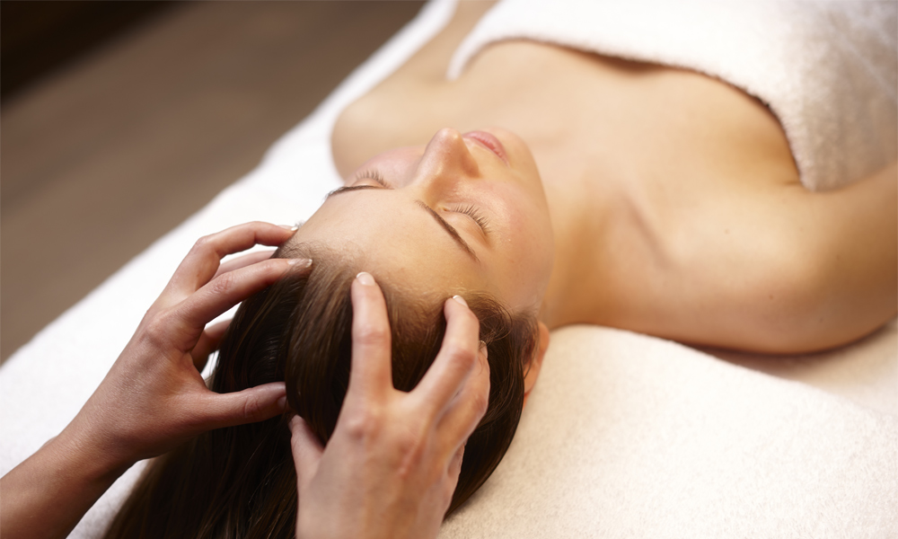women receiving a scalp massage
