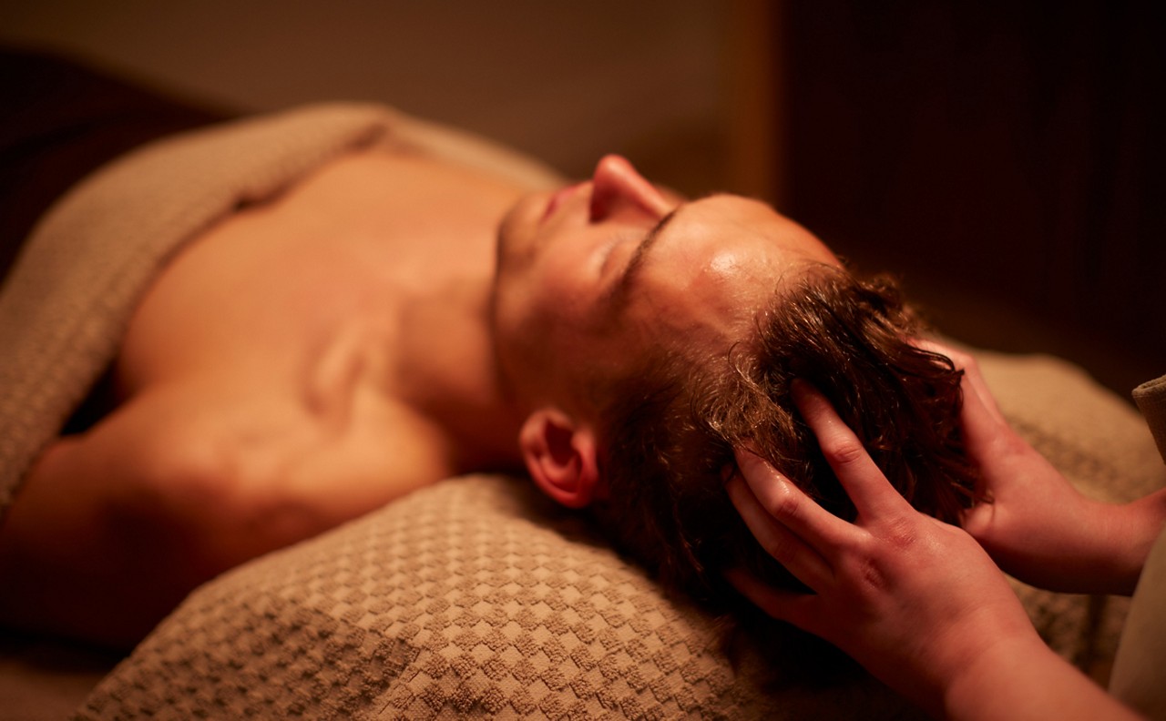 Man having a relaxing scalp massage.