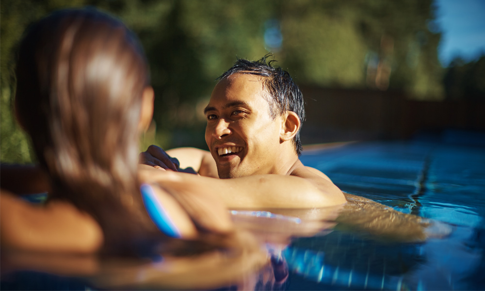 man and women in outdoor pool